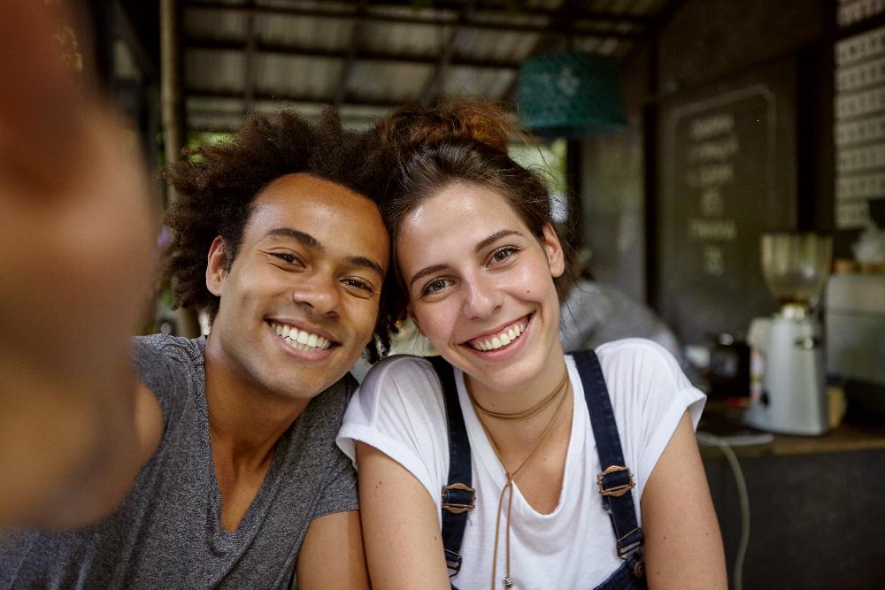 man and woman smiling